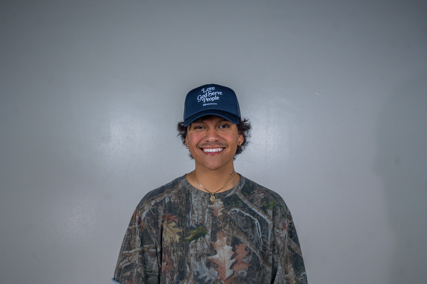 Love God Serve People Trucker Hat